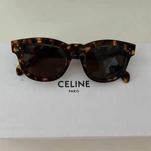 Celine Sunglasses  tortoise shell coloring. Dark green lenses.